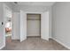 Bright bedroom features carpet flooring and a closet with white doors at 6715 Raritan Dr, Denver, CO 80221