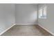 Bedroom with carpet, light-grey walls and a window providing plenty of light at 6715 Raritan Dr, Denver, CO 80221
