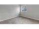 This bedroom has carpet flooring and a window that lets in plenty of light at 6715 Raritan Dr, Denver, CO 80221