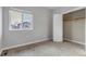 Bedroom featuring carpeted floor, light walls, and a closet with a single white door at 6715 Raritan Dr, Denver, CO 80221