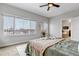 Comfortable bedroom with large windows, carpeted floors, and stylish decor at 6715 Raritan Dr, Denver, CO 80221