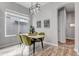 Modern dining area showcasing a stylish table, contemporary lighting, and elegant wall art at 6715 Raritan Dr, Denver, CO 80221