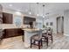 Beautifully designed kitchen featuring wood-look floors, a kitchen island, and stainless steel appliances at 6715 Raritan Dr, Denver, CO 80221