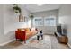 Bright living room with a comfortable sofa, stylish rug, and lots of natural light at 6715 Raritan Dr, Denver, CO 80221