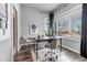 Well-lit office space featuring hardwood floors, large windows, and modern decor at 6715 Raritan Dr, Denver, CO 80221