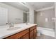 Bathroom with double sink, tub, and shower combination at 4666 S Malaya Ct, Aurora, CO 80015