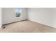 Carpeted bedroom with neutral walls and a window at 4666 S Malaya Ct, Aurora, CO 80015