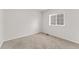 Bright bedroom with neutral carpeting and a window for natural light at 4666 S Malaya Ct, Aurora, CO 80015