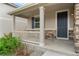 Inviting covered porch with craftsman style columns and railing, perfect for enjoying the outdoors at 4666 S Malaya Ct, Aurora, CO 80015