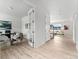Bright home office with french doors, light wood floors and ample natural light at 4666 S Malaya Ct, Aurora, CO 80015