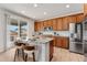 Beautiful kitchen with stainless steel appliances, granite countertops, and sliding glass door to patio at 4666 S Malaya Ct, Aurora, CO 80015
