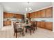 Modern kitchen with stainless appliances, a center island, and ample cabinet space at 4666 S Malaya Ct, Aurora, CO 80015