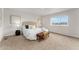 Spacious main bedroom with a large window and stylish decor at 4666 S Malaya Ct, Aurora, CO 80015