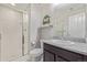 Bathroom featuring tiled shower, vanity with granite countertop, toilet, and car decor at 12510 Fisher St, Englewood, CO 80112