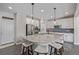 Beautiful kitchen with granite counters, stainless steel appliances, and a large center island with seating at 12510 Fisher St, Englewood, CO 80112