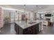 Spacious kitchen with granite countertops and a generous island with stainless steel dishwasher at 12510 Fisher St, Englewood, CO 80112