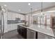 Well-designed kitchen with modern appliances, granite counters, and ample cabinet space at 12510 Fisher St, Englewood, CO 80112