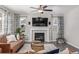 Inviting living room featuring a modern fireplace, TV, and neutral decor at 12510 Fisher St, Englewood, CO 80112