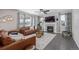 Comfortable living room with a cozy fireplace, hardwood floors, and stylish decor at 12510 Fisher St, Englewood, CO 80112