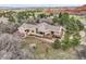 Beautiful aerial view showcasing the property, decks, and surrounding landscape at 6201 Rain Dance Trl, Littleton, CO 80125
