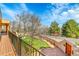 Elevated deck and lush green lawn in backyard create a serene outdoor space at 6201 Rain Dance Trl, Littleton, CO 80125