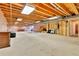 Unfinished basement with exposed wood beams and pink insulation, ready for customization at 6201 Rain Dance Trl, Littleton, CO 80125