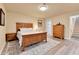Bedroom with wood furnishings and wood laminate flooring at 6201 Rain Dance Trl, Littleton, CO 80125