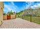 Wood deck area with mountain views and a wooden gate at 6201 Rain Dance Trl, Littleton, CO 80125
