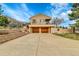 Stunning two-story home with a spacious driveway and a two-car garage, perfect for modern living at 6201 Rain Dance Trl, Littleton, CO 80125