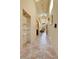 A bright hallway features tile floors, recessed lighting, skylights, and display shelves at 6201 Rain Dance Trl, Littleton, CO 80125