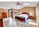 Comfortable main bedroom featuring a cozy sitting area and ample natural light at 6201 Rain Dance Trl, Littleton, CO 80125