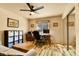 Office featuring a wooden desk, chair, neutral walls, ceiling fan and closet at 6201 Rain Dance Trl, Littleton, CO 80125