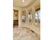 Cozy sitting area with tile floors, neutral walls, and plenty of natural light at 6201 Rain Dance Trl, Littleton, CO 80125