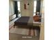 Bright bedroom with a modern bed, stylish rug, and natural light from a large window at 2500 S York St # 401, Denver, CO 80210