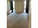 Bedroom featuring carpeted floors, neutral walls, and a large window with great sunlight at 2500 S York St # 401, Denver, CO 80210