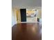 Living space featuring wood floors, kitchen, dining area, and a view from the window at 2500 S York St # 401, Denver, CO 80210