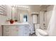 Well-lit bathroom featuring a marble countertop vanity and a shower-tub combination at 8690 Decatur St # 305, Westminster, CO 80031