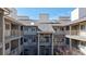 Exterior courtyard view showcasing multiple units with balcony access, highlighting a communal living space at 8690 Decatur St # 305, Westminster, CO 80031