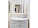 Bathroom vanity features a white cabinet, white countertop, and a mirrored medicine cabinet at 10422 Nelson Ct, Broomfield, CO 80021