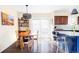 Open floor plan includes dining area and kitchen with breakfast bar, with great natural light at 10422 Nelson Ct, Broomfield, CO 80021