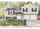 Charming two-story home with a manicured lawn, double-door entry, and a two-car garage at 10422 Nelson Ct, Broomfield, CO 80021