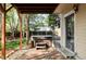Backyard patio area featuring a relaxing hot tub covered by a wood pergola and lush greenery at 10422 Nelson Ct, Broomfield, CO 80021