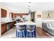Kitchen with center island and barstools, stainless appliances, and an open layout at 10422 Nelson Ct, Broomfield, CO 80021