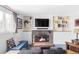 Cozy living room features a fireplace, built-in shelves, and comfortable seating area at 10422 Nelson Ct, Broomfield, CO 80021