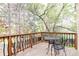 Relax on the upper deck with table and seating, surrounded by mature trees and fresh air at 10422 Nelson Ct, Broomfield, CO 80021