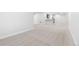 Open basement area with neutral carpet and paint offering a blank canvas for customization and ample living space at 9688 Winterset Cir, Littleton, CO 80125