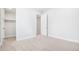 Bright bedroom with carpet, a walk-in closet and white trim at 9688 Winterset Cir, Littleton, CO 80125