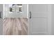 Bedroom featuring hard wood flooring and a door with white trim at 9688 Winterset Cir, Littleton, CO 80125