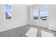 Spacious bedroom with natural light and neutral carpet at 9688 Winterset Cir, Littleton, CO 80125