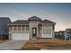 Charming single-Gathering home boasts craftsman details, a 2-car garage, and inviting curb appeal at 9688 Winterset Cir, Littleton, CO 80125